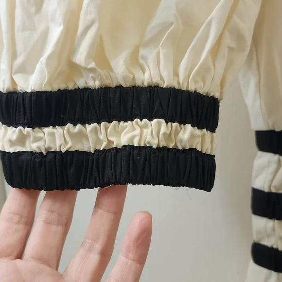 Aureum Elegant Cream Dress with Black Accents - Picture 4 of 11